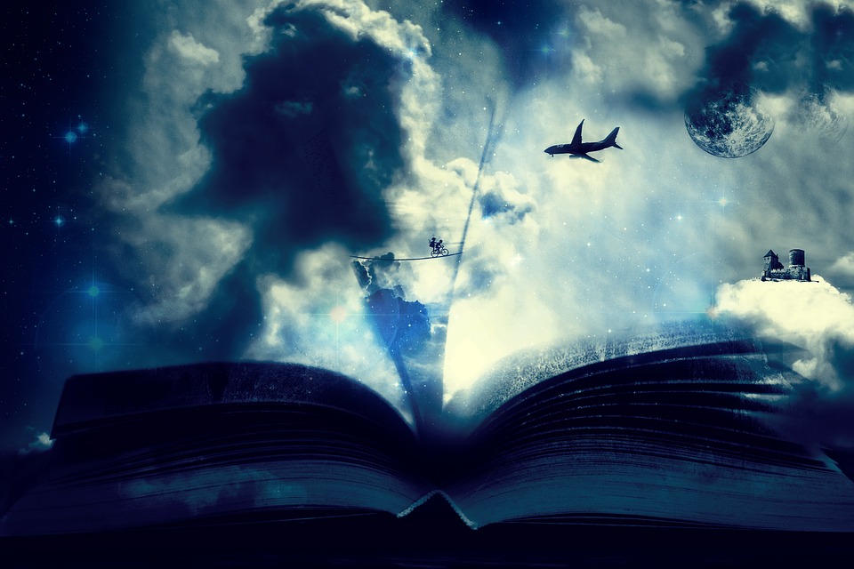 Wielka otwarta książka, nad nią samolot, chłopiec na rowerze, zamek na chmurze.